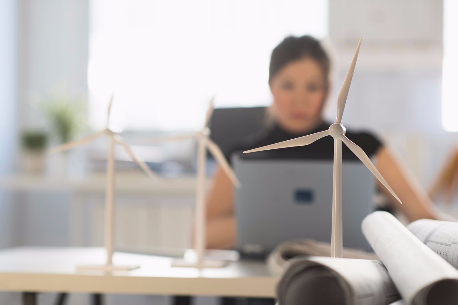 young woman on computer wind turbines